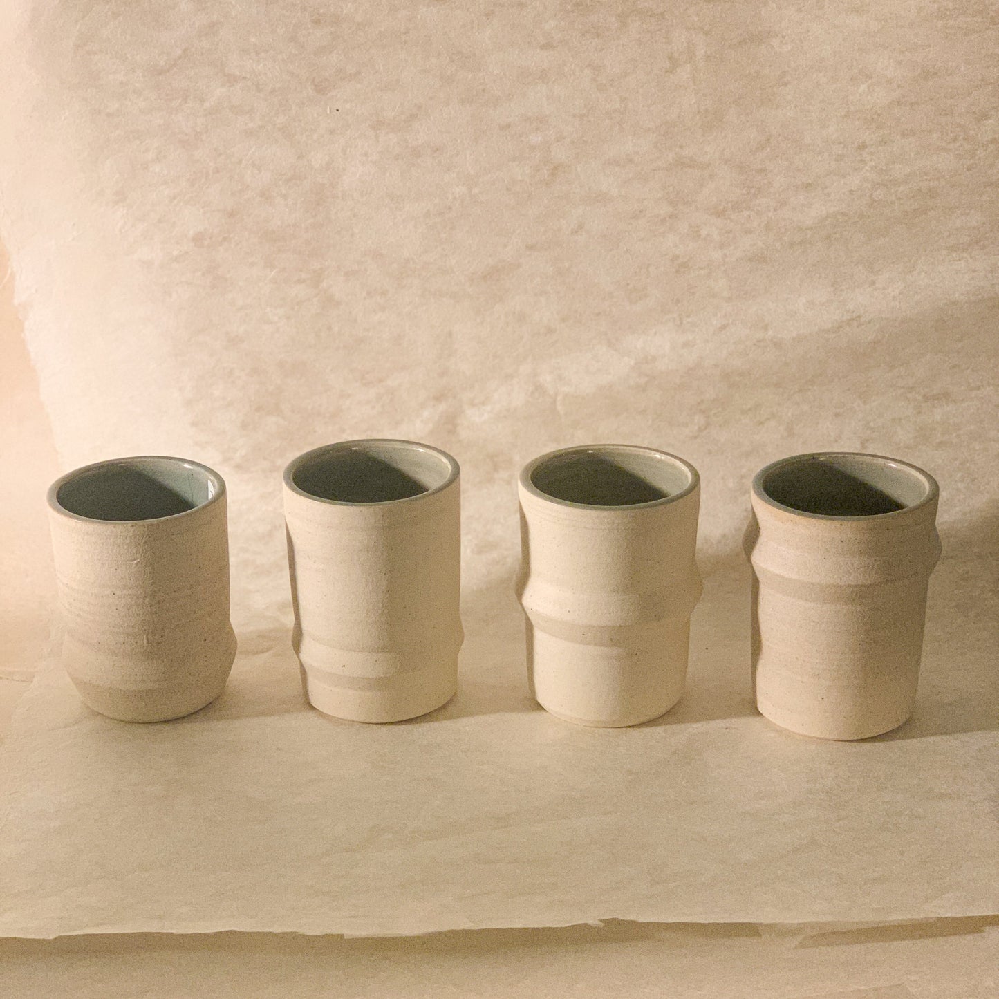 Olivia Snow Ceramics - Saturn Ceramic Tumblers in White and Celadon